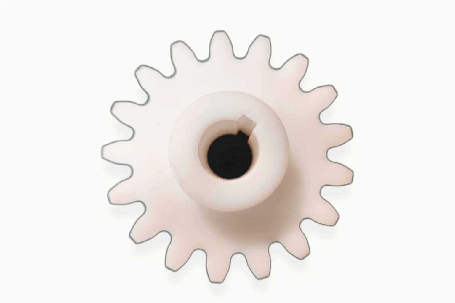 White acetal plastic sprocket gear with keyed bore, machined — Toolmetrics Engineers